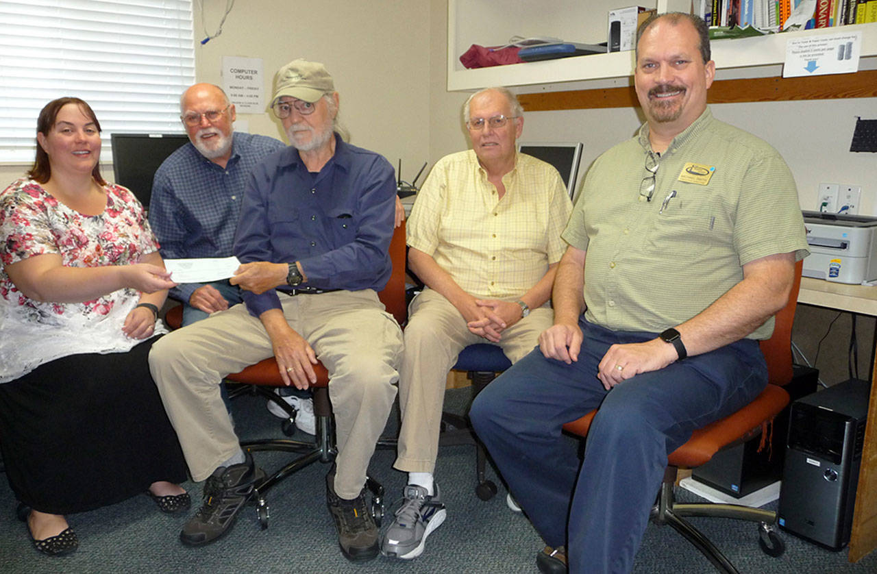From left are Michelle Rhodes, of the Shipley Center; Tom LaMure and Jim Hurley of the Sequim PC Users Group; Steve Solberg of SPCUG and the Shipley Center&rsquo;s IT specialist; and Shipley Center Executive Director Michael Smith. Sequim Gazette photo by Patricia Morrison Coate