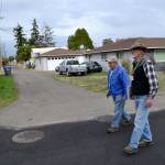In September 2015, Ernie Karger, a Habitat for Humanity volunteer, and Bryce Fish with the Sequim Sunrise Rotary, assess homes near Fir Street as part of the Habitat for Humanity of Clallam County&rsquo;s Neighborhood Revitalization project. This project served as a springboard for Habitat for Humanity, leaders say, to begin tracking quality of life in the area. Sequim Gazette file photo by Matthew Nash