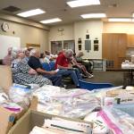 Strait Stamp Society members gather on Aug. 2 in the Sequim Library for their monthly meeting. There they discussed logistics for their 24th annual show on Aug. 12 and some of their recent discoveries while collecting. Sequim Gazette photo by Matthew Nash