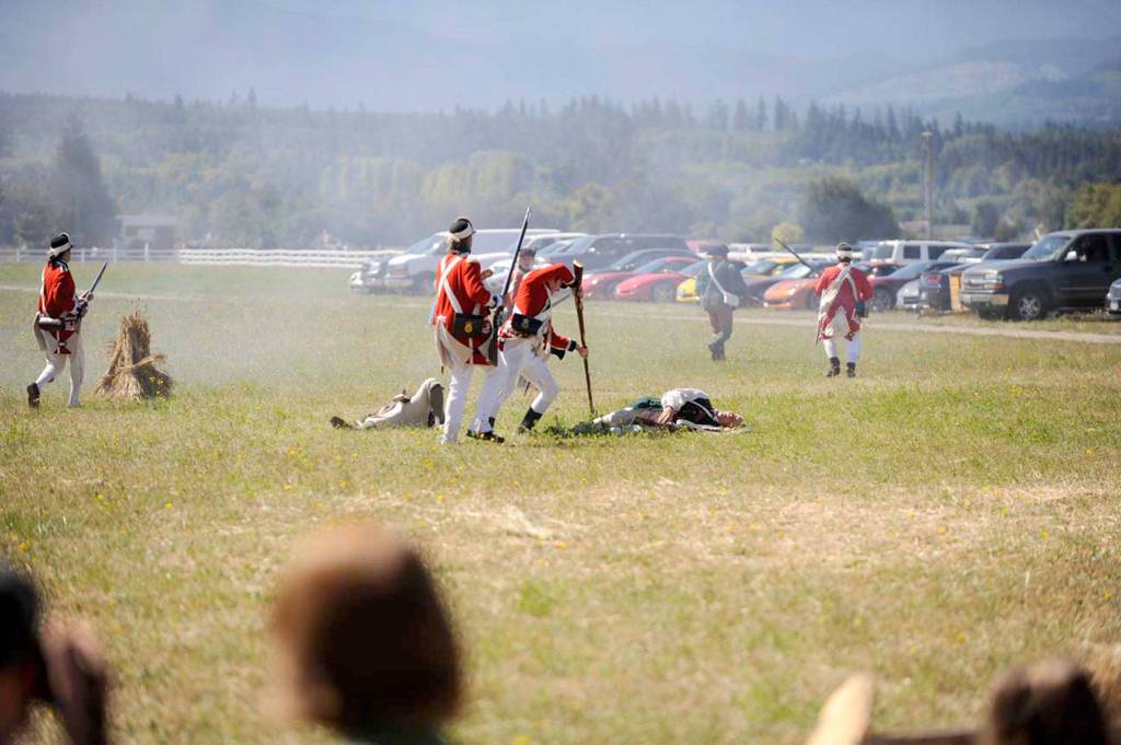 British Recoats attack colonists after hearing the &ldquo;shot heard round the world&rdquo; at last year&rsquo;s Northwest Colonial Festival. This year organizers have included more reenactors on both sides. Sequim Gazette file photo by Matthew Nash
