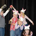 179                                The Big Bad Wolf, Finn Waknitz, threatens to blow down the houses of the Three Little Pigs, played by Nicholas Burke, Madeline Irwin, Mabel Waknitz and Piper Wikert. Photos by Brandi Welch