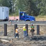 Crewmen under contract with the Department of Transportation stand atop a culvert for Matriotti Creek on Aug. 8 that will be replaced with a larger one to increase fish passage and habitat. Sequim Gazette photo by Matthew Nash