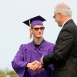 Michael Ray Barbour accepts his Sequim High School diploma from Sequim schools superintendent Gary Neal on Aug. 5. Sequim Gazette photo by Michael Dashiell