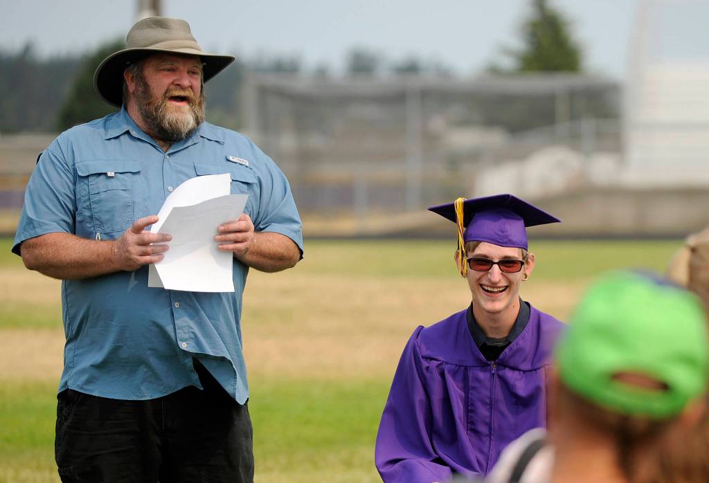 Faculty-elected speaker Kevin Phillips tells stories about his student Michael Ray Barbour, Sequim High&rsquo;s newest graduate. Sequim Gazette photo by Michael Dashiell