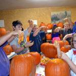 Children celebrate at the Pumpkin Party in the Sequim Prairie Grange&rsquo;s outdoor kitchen a few years ago. The event grew from an effort to start a Junior Grange in the area and has continued for 12 years each October. Sequim Gazette file photo by Matthew Nash