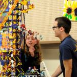 Ellie Hiigler, 15, and Justin Jackson with Port Angeles Junior ROTC look at a building block display created by 7-year-old Digeo Waterkotte of Port Angeles. This year, the Junior ROTC helped set up the Arts and Crafts barn. Sequim Gazette photo by Matthew Nash