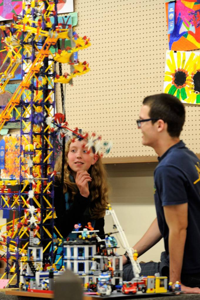 Ellie Hiigler, 15, and Justin Jackson with Port Angeles Junior ROTC look at a building block display created by 7-year-old Digeo Waterkotte of Port Angeles. This year, the Junior ROTC helped set up the Arts and Crafts barn. Sequim Gazette photo by Matthew Nash