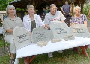 WSU Clallam County Master Gardeners, from left, Cindy Ericksen, Diane Ross, Bill Wrobel and Alice McElroy received the lifetime achievement Golden Trowel Award on Aug. 1 at the Master Gardener Demonstration Garden. Photo by Marilynn Elliott