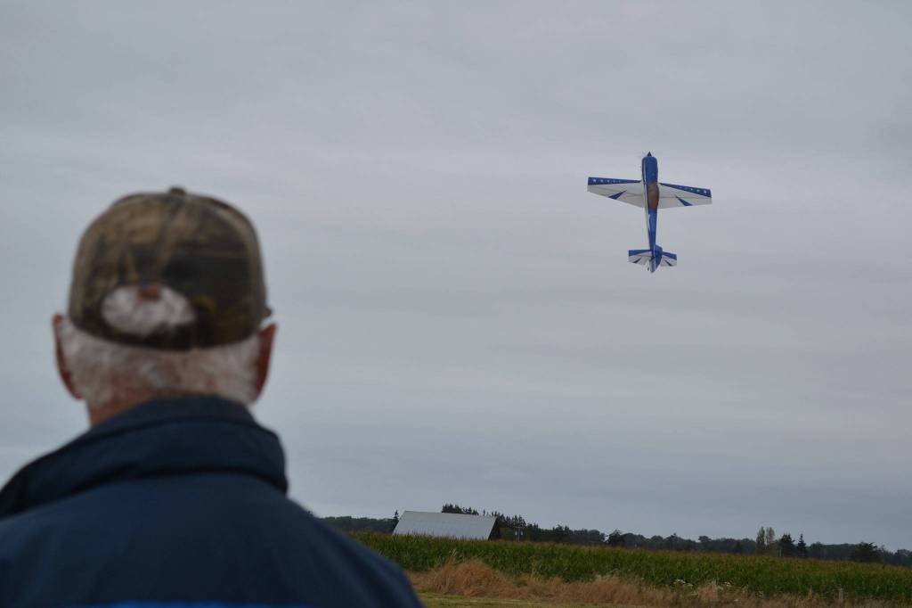 Remote control airplanes, like this one being flown by Barry Johnson of the Sequim Aeronauts, return to do tricks both days of the Olympic Peninsula Air Affaire and Sequim Valley Fly-In on Aug. 26-27. Sequim Gazette file photos by Matthew Nash