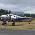 Visitors to the Olympic Peninsula Air Affaire last year admire Neil and Linda Morrison of Port Townsend&rsquo;s Beechcraft C45H that was first delivered to Childress Army Air Field, Texas, on Aug. 26, 1943, to service train bombardiers. Sequim Gazette file photo by Matthew Nash