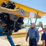 Richard Grennan and Mike Stegriy of Sequim talk with Jacob Kirschbaum, a volunteer with the Port Townsend Aero Museum, about the 1942 PT-17 Stearman restored as a World War II trainer plane on display at the Olympic Peninsula Air Affaire. Sequim Gazette photos by Erin Hawkins