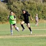 Kristina Mingoy, right, drives past teammate Daisy Ryan in a recent practice. Both girls helped Sequim win 11 games last season, its most ever in the program&rsquo;s history. Sequim Gazette photo by Matthew Nash
