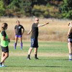 Derek Vander Velde, Sequim girls soccer head coach, seen talking to players at a recent practice, said this season he is pushing new players on the varsity squad to &ldquo;try something new for the benefit of the team.&rdquo; Sequim Gazette photo by Matthew Nash