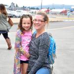 First-grader Shaye Ball arrives at Greywolf Elementary on Aug. 30 for the first day of school, all smiles, with her mom. Photo by Patsene Dashiell