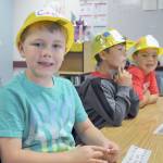 Greywolf Elementary School first-graders (from left) Cash Hiner, Isaiah Gradillas and Hunter Carlile are seated at their places and ready to begin the new school year.