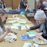 Olympic Peninsula Academy eighth-graders Sydnei Frymyer, left, and Faith Amaya complete a drawing assignment during Otter Day, a prelude to the first day of class on Sept. 5. Photo by Patsene Dashiell