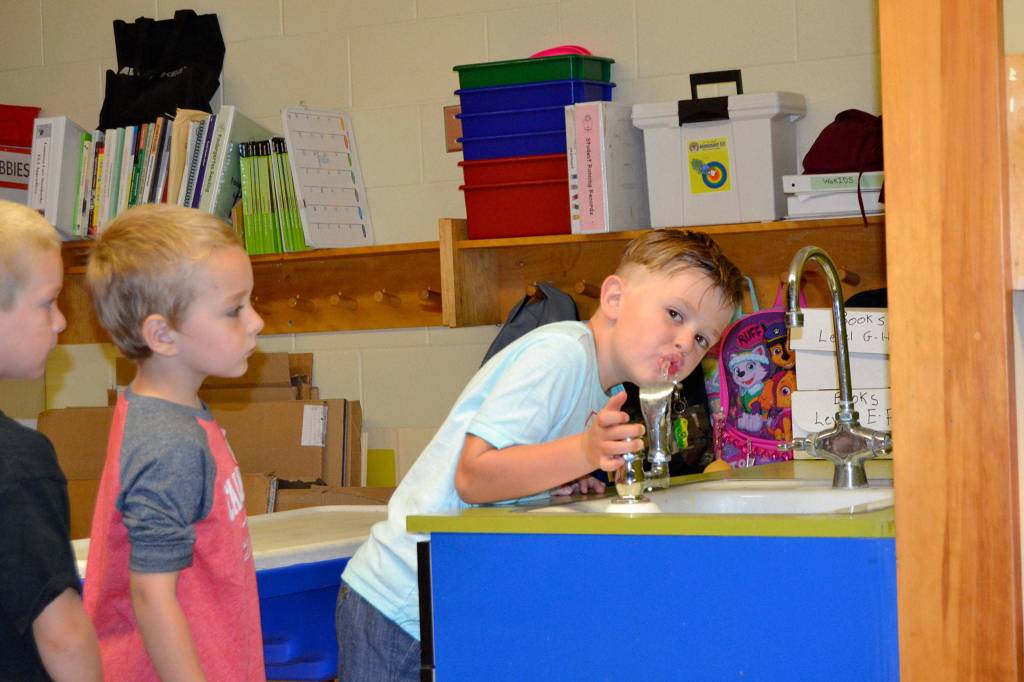 Kindergartener Mason Moore takes a drink from fountain in Melissa Novak&rsquo;s class in Helen Haller Elementary. She wanted each student to learn how to use the fountain. Sequim Gazette photo by Matthew Nash