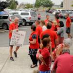 Sequim Middle School teacher Dave McInnes, left, and fellow teachers and school advocates gather outside the Sequim School District boardroom on Sept. 5. Sequim Gazette photo by Michael Dashiell