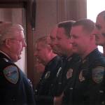 Outgoing police chief Byron Nelson, left, says goodbye to staff in a formal ceremony in 2002. Nelson died on Sept. 2. Sequim Gazette file photo