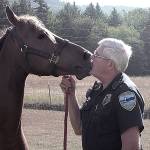 Byron Nelson, then the outgoing police chief in Sequim, enjoys a moment with his horse Ariana at his Happy Valley home in August 2002. Nelson died at age 77 on Sept. 2. Sequim Gazette file photo by Michael Dashiell