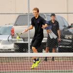 As teammate Blake Wiker looks on, Liam Payne wins a straight-set victory over North Mason&rsquo;s Zach Gamblin on Sept. 7. Sequim Gazette photos by Michael Dashiell