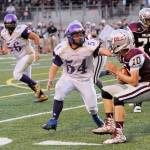 Sequim High defensive end Adam DeFillipo (54) looks to make a stop on Montesano quarterback Trevor Ridgway. Sequim Gazette photo by Michael Dashiell