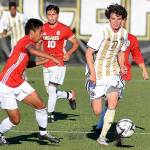 Peninsula&rsquo;s Michael Day, right, breaks through the Everett defense in the Pirates&rsquo; 6-1 win Sept. 13 in Port Angeles. Photo courtesy of Peninsula College