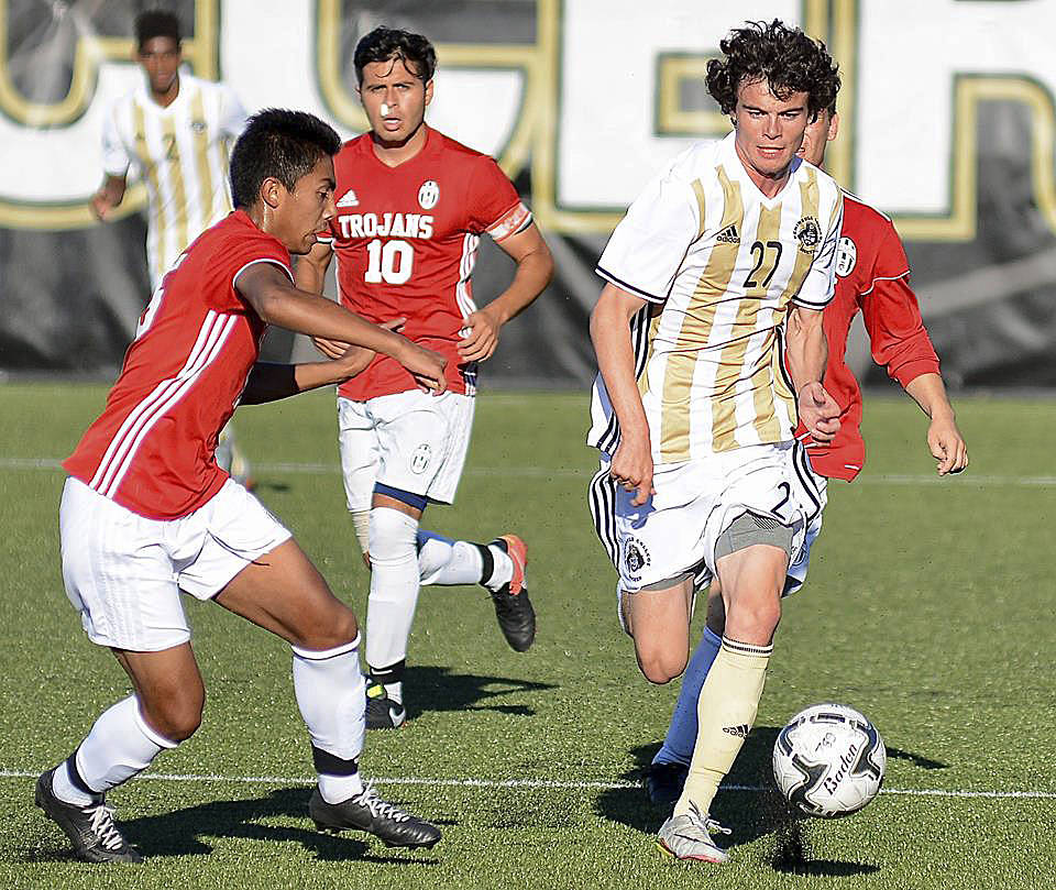 Peninsula&rsquo;s Michael Day, right, breaks through the Everett defense in the Pirates&rsquo; 6-1 win Sept. 13 in Port Angeles. Photo courtesy of Peninsula College