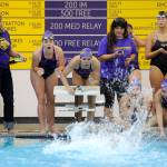 Teammates cheer on the anchor of Sequim&rsquo;s 200 medley relay team that clocked in at 2:01.54 &mdash; about a half-second under a state 2A meet qualifying time &mdash; as the Wolves take on Kingston on Sept. 14. The relay squad includes Sydnee Linnane, Sydney Swanson, Sonja Govertson and Jasmine Itti. Sequim Gazette photo by Michael Dashiell