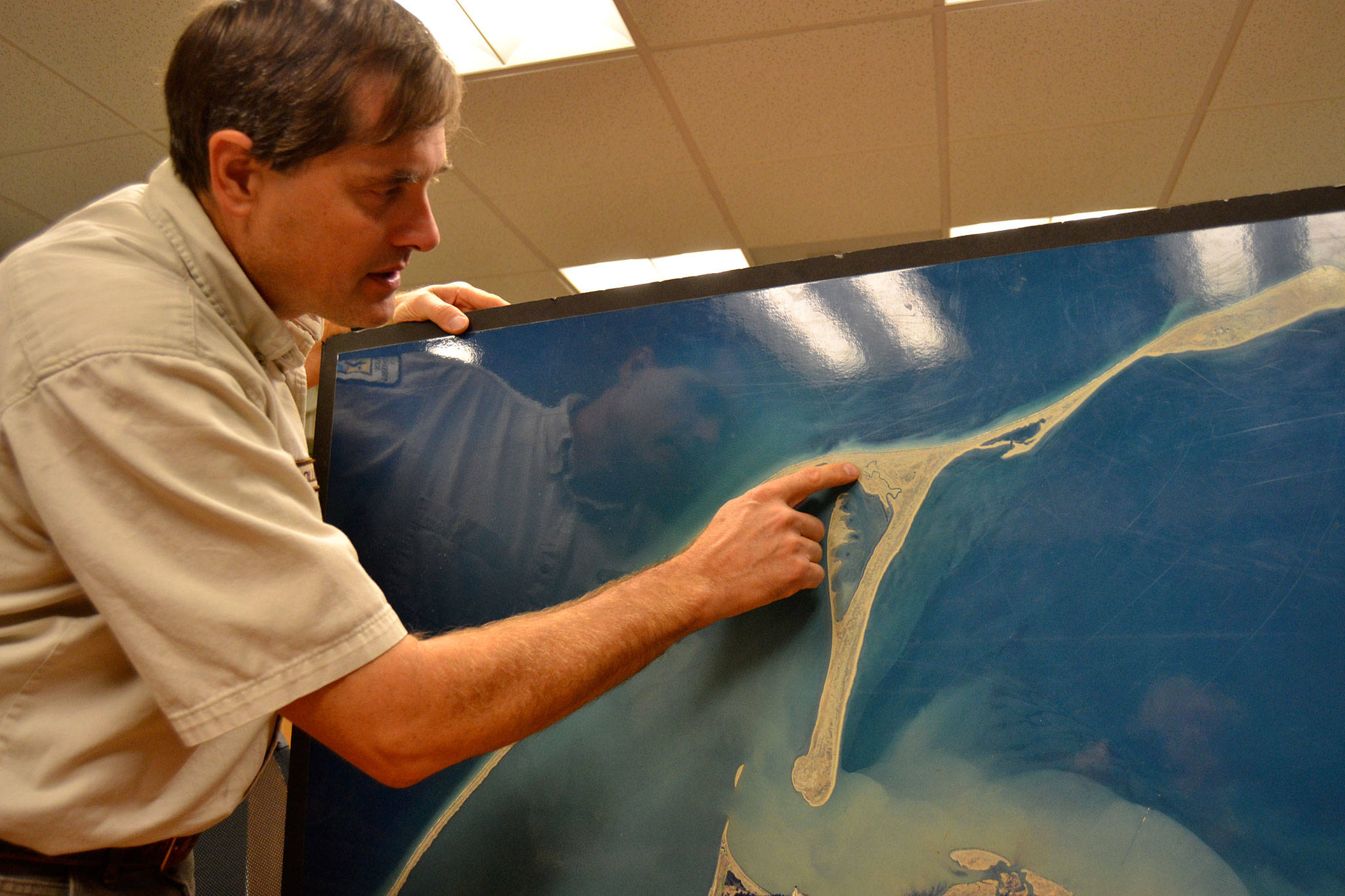 Lorenz Sollmann, deputy project leader at the Washington Maritime National Wildlife Refuge, points to the spot on Graveyard Spit where two female European green crabs were caught two weeks ago. Trapping efforts went about one month without capturing a green crab along the Dungeness Spit. Sequim Gazette photo by Matthew Nash
