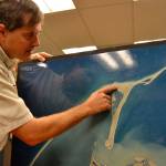 Lorenz Sollmann, deputy project leader at the Washington Maritime National Wildlife Refuge, points to the spot on Graveyard Spit where two female European green crabs were caught two weeks ago. Trapping efforts went about one month without capturing a green crab along the Dungeness Spit. Sequim Gazette photo by Matthew Nash