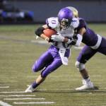 Sequim&rsquo;s Nate Despain tries to break free of a tackle as Sequim takes on north Kitsap on Sept. 29. Sequim Gazette photo by Michael Dashiell