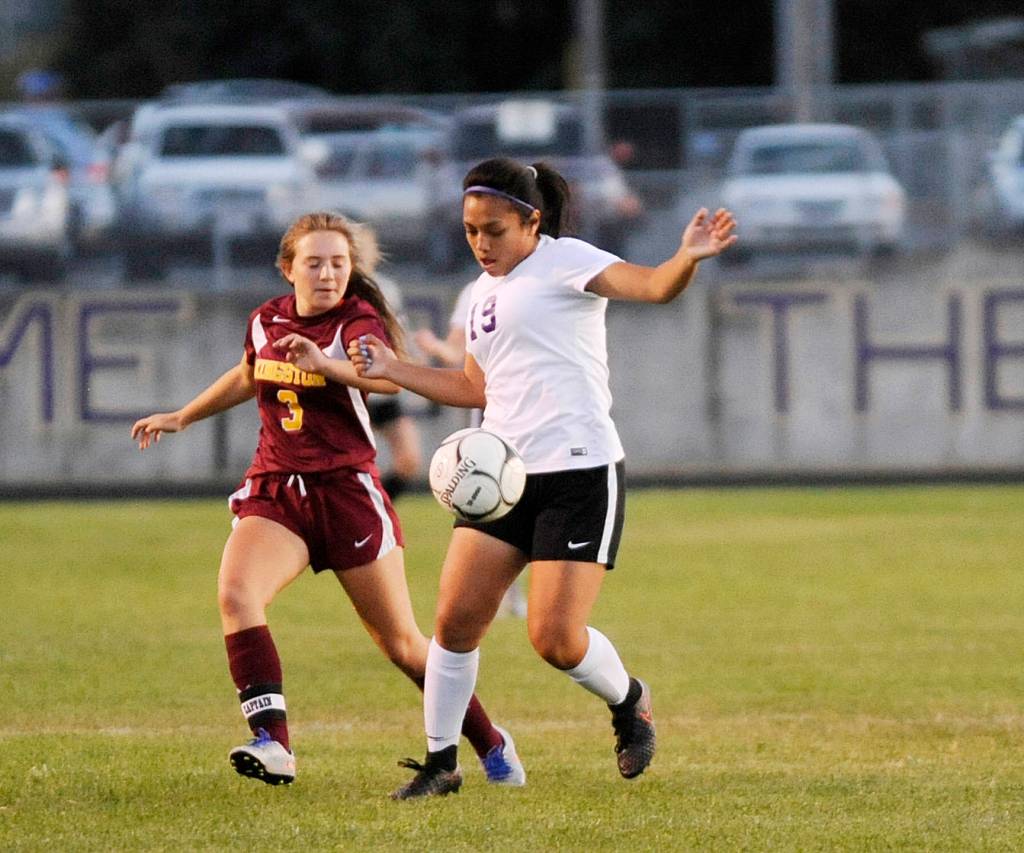 Sequim midfielder Natalie Torres keeps the ball from Kingston&rsquo;s Aimee Dormaier in the first half of the Wolves&rsquo; 2-0 win on Sept. 28. Sequim Gazette photo by Michael Dashiell