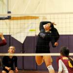 Sequim&rsquo;s Lindsey Leader (45) rises up for a big hit in a Sept. 28 match against Kingston; teammate Brittney Gale, far left, looks on. Sequim Gazette photo by Michael Dashiell