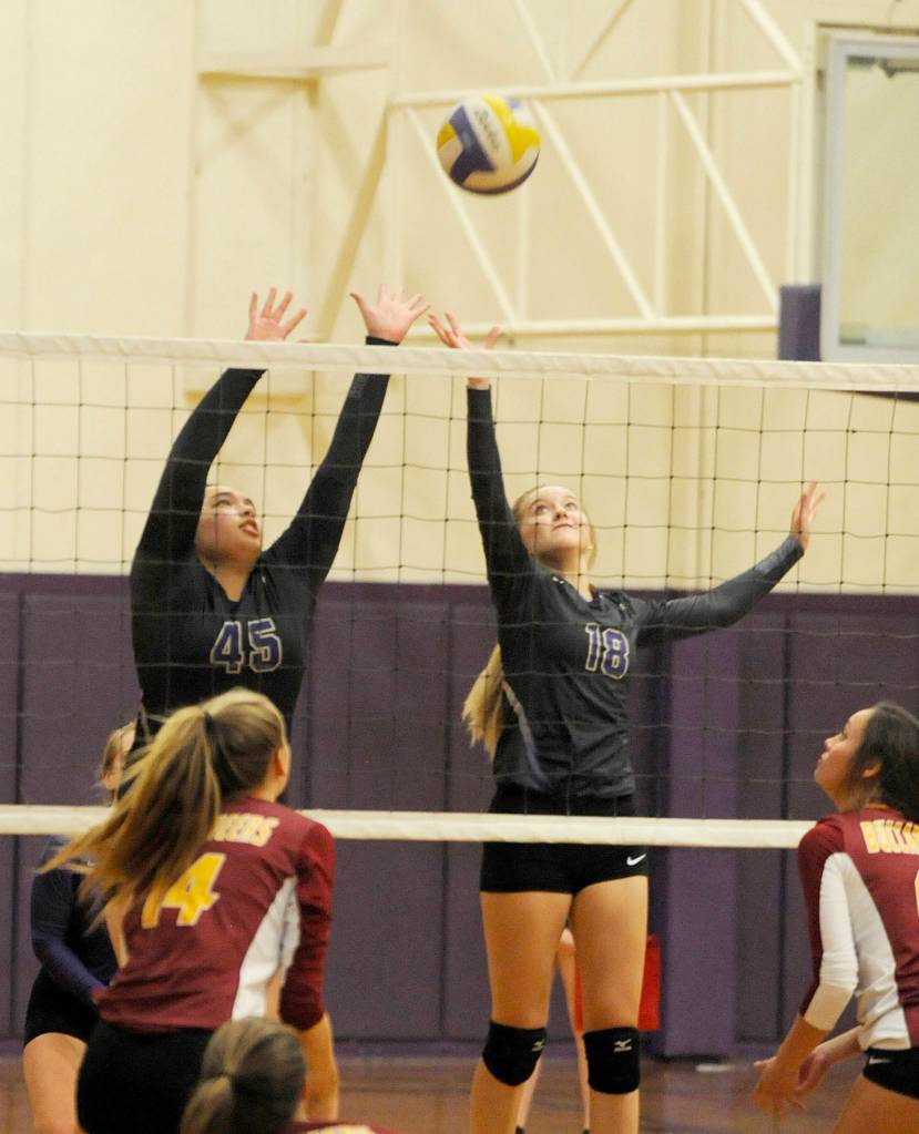 Sequim&rsquo;s Lindsey Leader (45) and Annika Christiansen (18) tip the ball at the net in the second game of a Sept. 28 match against Kingston. Sequim Gazette photo by Michael Dashiell