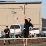Sequim&rsquo;s Kevin Meyer goes up for a hit at the net as doubles partner Sam Frymyer (cq) looks on as they take on Port Angeles&rsquo; Lucas Jarnagin and Milo Whitman on Oct. 5 in Sequim. Photo by Michael Dashiell/Sequim Gazette