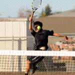 Sequim&rsquo;s Raymond Lam looks to return a serve as he takes on Kenny Soule, Port Angeles&rsquo; No. 1 singles player, on Oct. 5. Photo by Michael Dashiell/Sequim Gazette