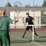 Sequim&rsquo;s Blake Wiker looks to return a shot as he and teammate Thomas Hughes take on Port Angeles&rsquo; Brady Nickerson and Kyler Tourbin on Oct. 5. Photo by Michael Dashiell/Sequim Gazette