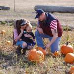 Last week, Danielle Brownell, Zachary Brownell and their 8-month-old son Grayson, of Forks, visit the Pumpkin Patch in Sequim for the first time. Sequim Gazette photo by Erin Hawkins