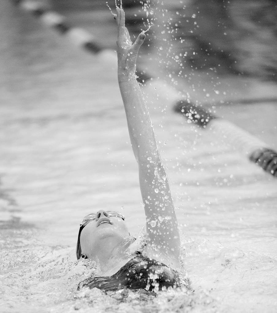 Eislynn Flood swims the backstroke leg of the 200 individual relay as the Sequim Wolves take on Klahowya Oct. 5 at the YMCA of Sequim. Sequim Gazette photo by Michael Dashiell