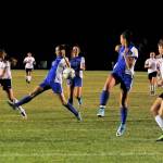 Sequim Forward Jessica Dietzman advances the ball towards teammate Hope Glasser near Olympic&rsquo;s goal on Oct. 5. The Wolves lost 2-0 but maintained a spot for districts. Sequim Gazette photo by Matthew Nash