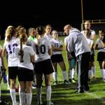 Sequim Coach Derek Vander Velde speaks to the Wolves at halftime trying to energize them against the Olympic Trojans. Sequim Gazette photo by Matthew Nash