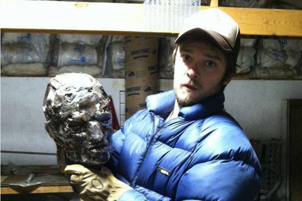 Per Berg, seen holding a metal man statue he designed, continues to focus on his comic book career while living in Seattle. He sees himself as working in the &ldquo;minor leagues&rdquo; and he hopes to make it to the &ldquo;big league&rdquo; with his upcoming work including his new comic book &ldquo;Earthbound.&rdquo; Submitted photo
