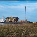 A 1916 Sears kit house arrives on Cline Spit on Oct. 9.