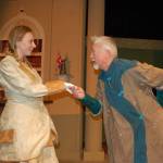 Liz Duval cast as Phyllida Spotte-Hume and her twin Countess Glamorgan and Greg Scherer playing the part of president Harry Percy act out a scene from the upcoming play &ldquo;The Explorer&rsquo;s Club&rdquo; that will run from Oct. 20-Nov. 5 at Olympic Theatre Arts. Sequim Gazette photo by Erin Hawkins