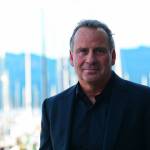 Ethan Wayne, whose father is the namesake of John Wayne Marina, visited Saturday to honor former Port of Port Angeles Executive Director Jerry Hendricks, who was instrumental in moving the marina project forward. (Jesse Major/Peninsula Daily News)