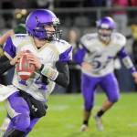 Sequim quarterback Riley Cowan looks for running room as he and the Wolves knock off host Port Angeles on Oct. 20. Cowan ran for 52 yards and a touchdown in the win. Sequim Gazette photo by Michael Dashiell