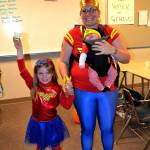 Sequim Wonder Women Piper, 6, Laila, 2 months old, and mom Rebekah Jackson strike a super pose at Haunted Hallways.