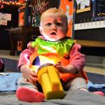 Alice Marie Michael, 1, of Sequim, enjoys the atmosphere of the Sequim Boys & Girls Club as she plays with a flashlight.