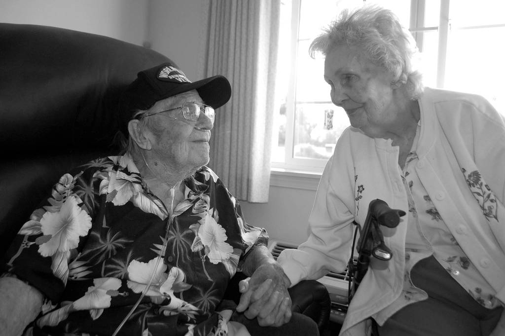 Bill Andrew, 91, and Mary Andrew, 90, hold hands and share their journey of more than 70 years of marriage together at their home in Sinclair Place. Sequim Gazette photo by Erin Hawkins